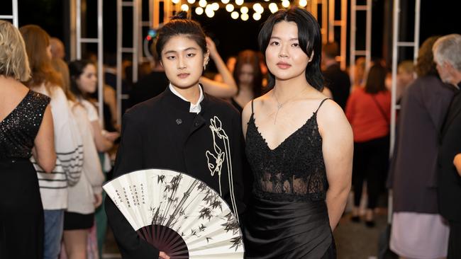 Gloria Zhou and Miranda Wang at the year 12 St Hilda formal. Photo: Celeste Humphrey