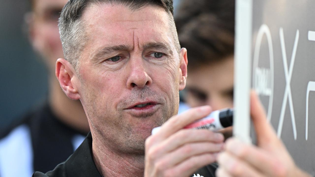 Collingwood coach Craig McRae says Geelong coach Chris Scott’s famous selection antics means it would be unwise for the Magpies to react to what the Cats put down on paper. Picture: Steve Bell / Getty Images