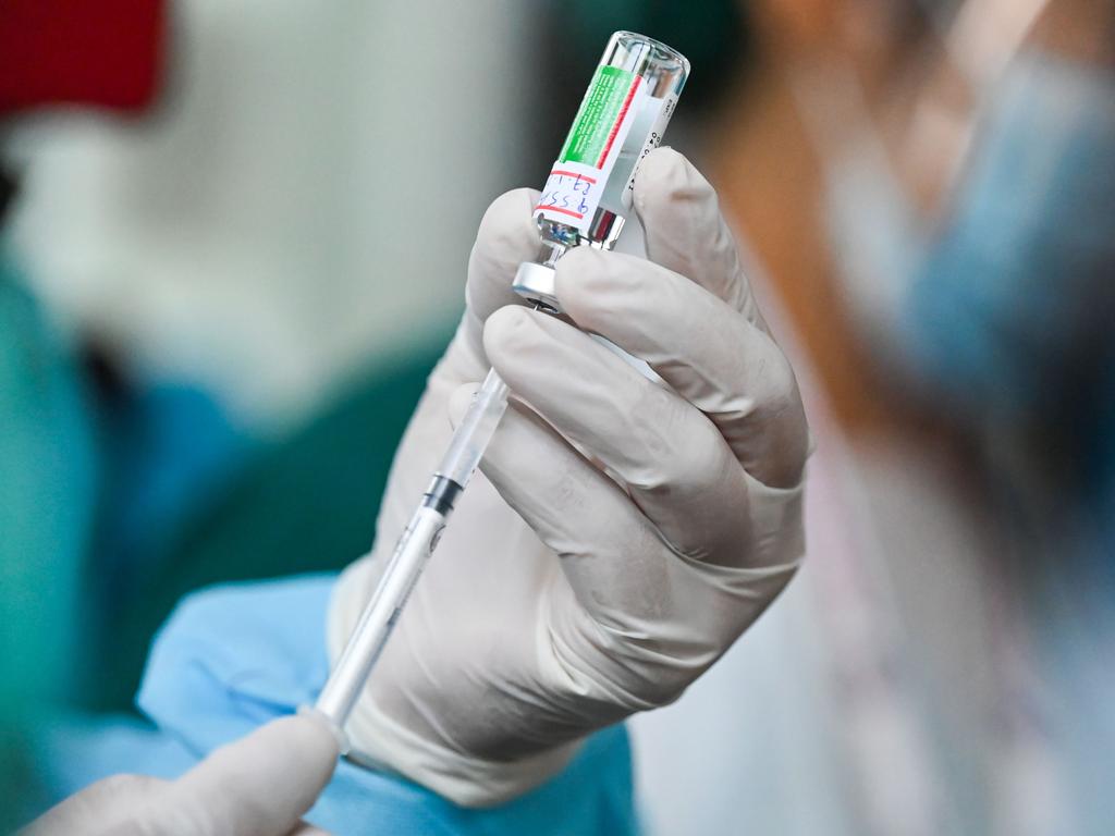 A health worker holds up a vial of the AstraZeneca-Oxford COVID-19 vaccine. Picture: Ye Aung Thu/AFP