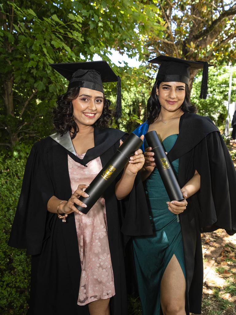 Bachelor of Business graduate Aastha Pandey (left) and Bachelor of Nursing graduate Srijana Kattel at the UniSQ graduation ceremony at Empire Theatres, Wednesday, December 14, 2022.