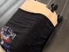 Woman’s suitcase act sparks heated debate