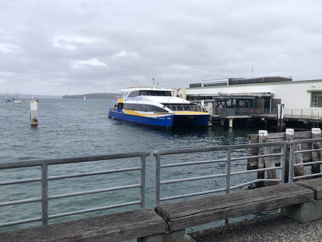 The current “ship railing” steel fencing around Manly Wharf, will have glass or perspex screens attached to make it more difficult to climb over. Old wooden and concrete seating will be removed. Picture: Jim O’Rourke