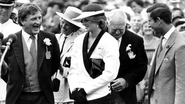 Diana and Charles, the Prince and Princess of Wales share a joke with businessman John Elliott during their visit in 1985.