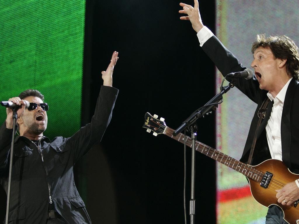 July 2, 2005. George Michael, left, and Paul McCartney, right, perform during the Live 8 concert in Hyde Park, London. The concert is part of a series of free concerts being held around the world designed to press leaders of the rich G8 countries to help impoverished African nations.PIcture: AP Photo/Lefteris Pitarakis