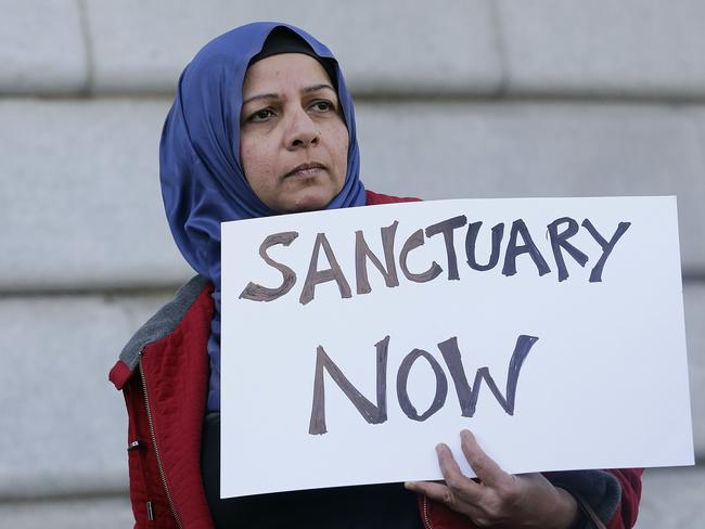 People around the country have protested Donald Trump’s order to shut down sanctuary cities. Overnight a federal judge blocked the order to withhold funding from communities that limit co-operation with U.S. immigration authorities. Picture: Jeff Chiu / AP