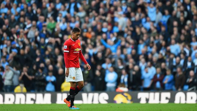 Chris Smalling of Manchester United leaves the field after receiving a red card.