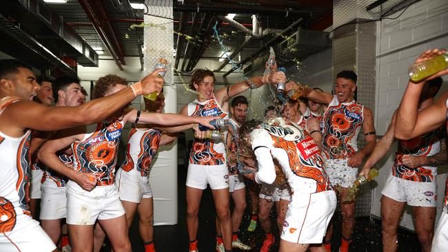 GWS players enjoy their victory over Geelong.