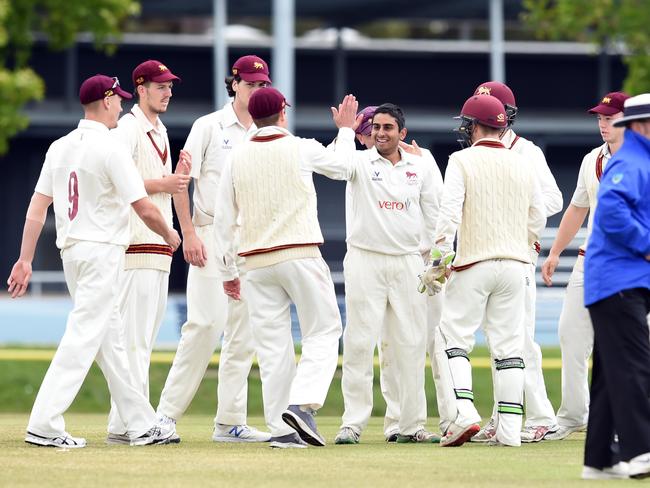 Teammates huddle around Ejaaz Alavi Picture: David Smith.