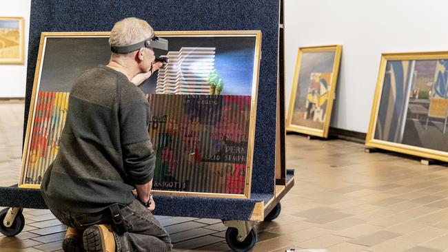 Jeffrey Smart’s Corrugated Gioconda being checked at National Gallery of Australia, Canberra.