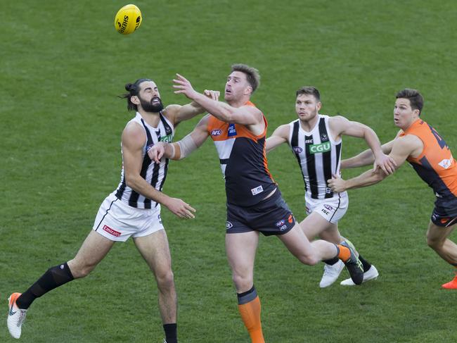 Brodie Grundy had another huge game for the Pies in a battle against GWS twin towers Dawson Simpson and Shane Mumford. Picture: AAP