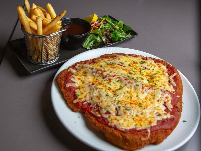 One of the Cascade Hotel’s giant chicken parmies. Picture: Linda Higginson