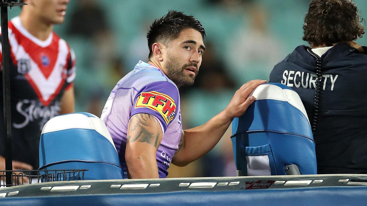 Cronulla's Shaun Johnson leaves the field with an injury.