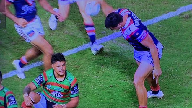 Joey Manu slams the ball into the turf near Latrell Mitchell aftre scoring for the Roosters.