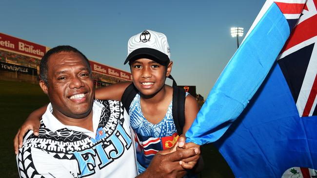 Iowani Cavuilati aged 11 in 2017 with his father - Iowani senior, celebrating their native Fiji playing in the league World Cup. Picture: Zak Simmonds