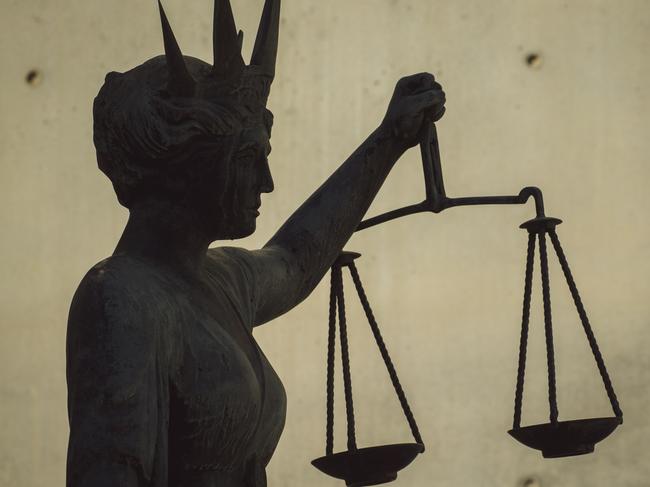 BRISBANE , AUSTRALIA - NewsWire Photos - BRISBANE , JUNE 24 2024: Generic photo of the scales of justice stature outside Brisbane Supreme Court in the Brisbane CBD. Picture: NewsWire / Glenn Campbell