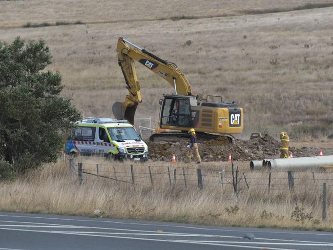 A digger at the site of the collapsed trench.