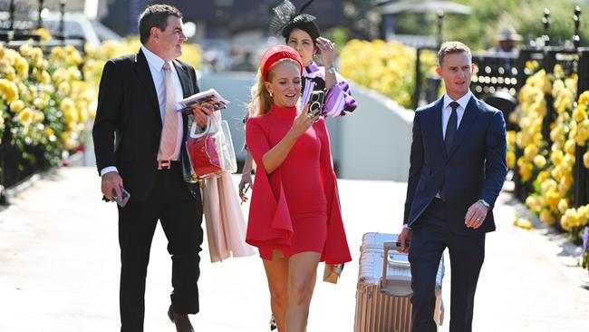 Jockey Zac Purton arrives with his wife, Nicole. Picture: Getty Images