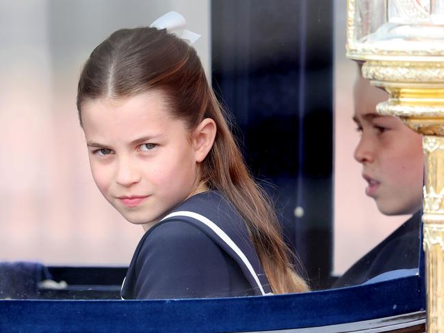 Princess Charlotte travels in the glass coach with her mother and brothers. Picture: Getty Images