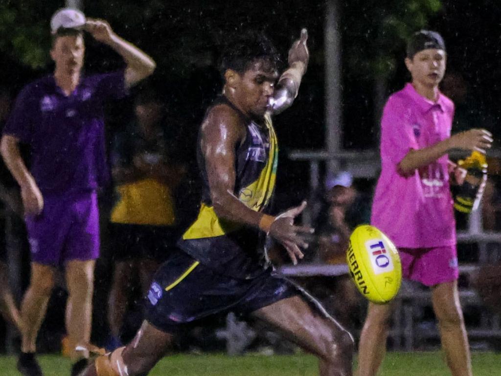 Phoenix Joe Pool kicks clear against PINT at Nightcliff Oval. Picture: Celina Whan / AFLNT Media.