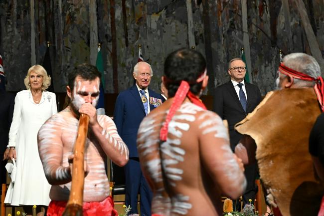 Britain's King Charles III and Queen Camilla observe Aboriginal dancers as they attend a Parliamentary reception hosted by Australian Prime Minister Anthony Albanese (R) at Parliament House in Canberra on October 21, 2024.