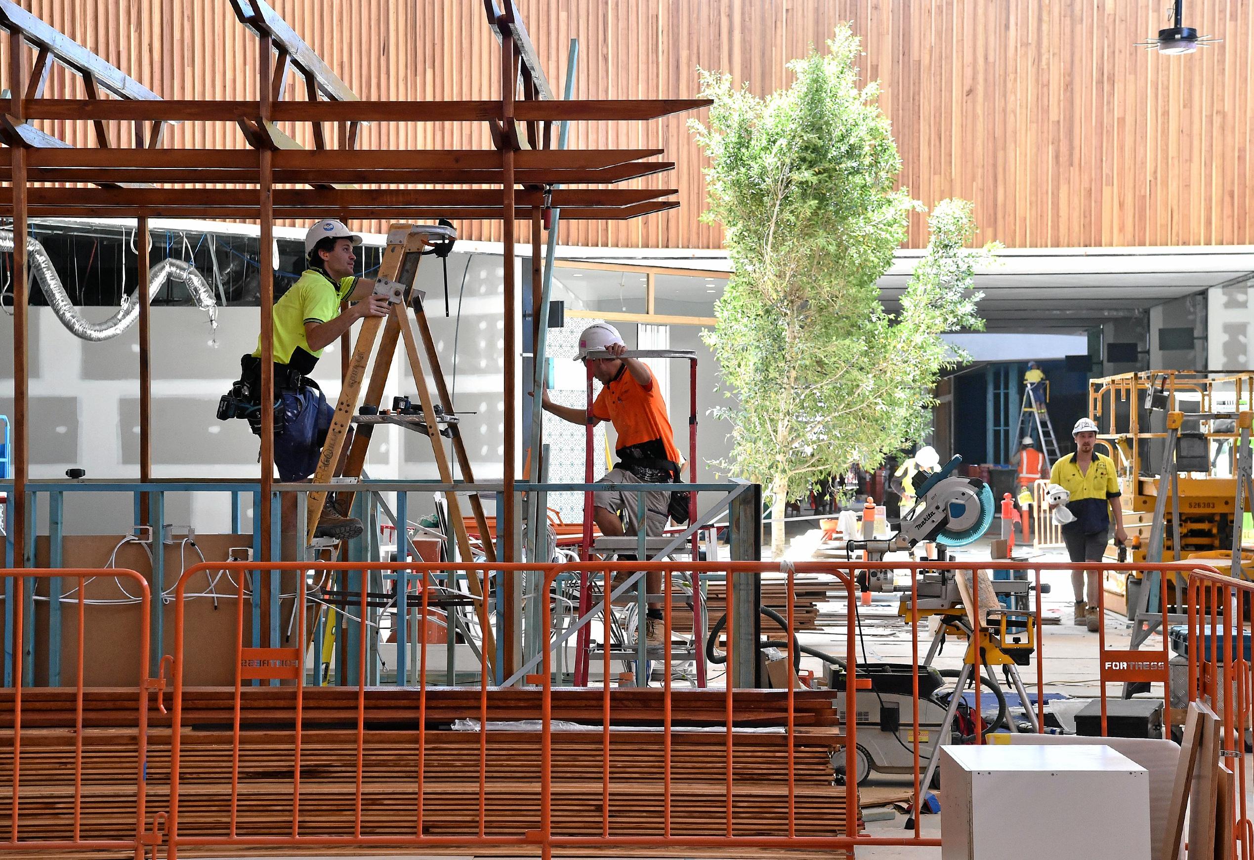 Full steam ahead for the opening of the Stockland Birtinya Shopping Centre. Constuction workers put the final pieces together for the grand opening in a couple of weeks. Picture: Warren Lynam