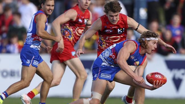 Aaron Naughton handballs before being tackled at Mars Stadium in Ballarat. Picture: Martin Keep/Getty Images