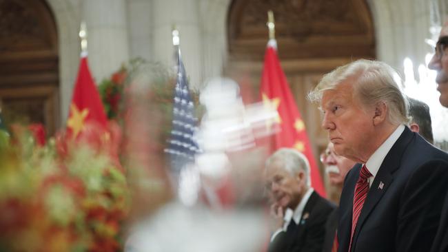 President Donald Trump listens to China's President Xi Jinping speak during their bilateral meeting.