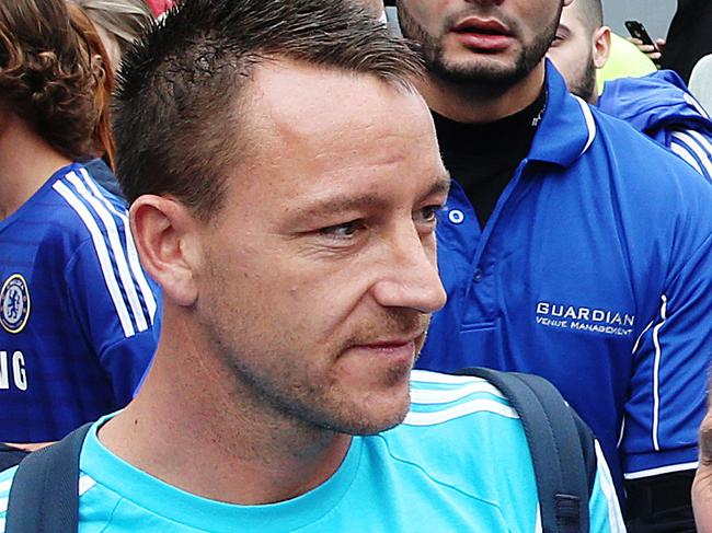 Chelsea FC captain John Terry being helped by security on the way to the team bus. Chelsea FC are in town to play Sydney FC . Picture Craig Greenhill