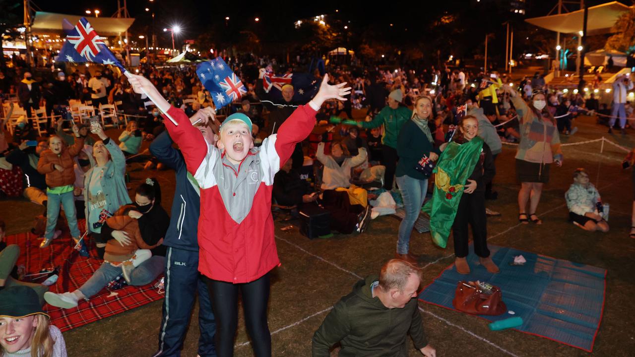 Audience members celebrate at Kings Beach in Caloundra as Brisbane is announced as the host of the 2032 Olympic Games. Picture: Lachie Millard