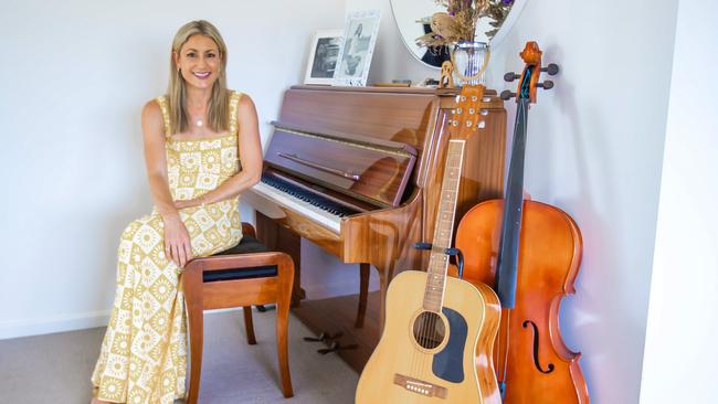 TV presenter Liz Cantor with her piano, which she taught herself to play during Covid. Picture: Nigel Hallett.