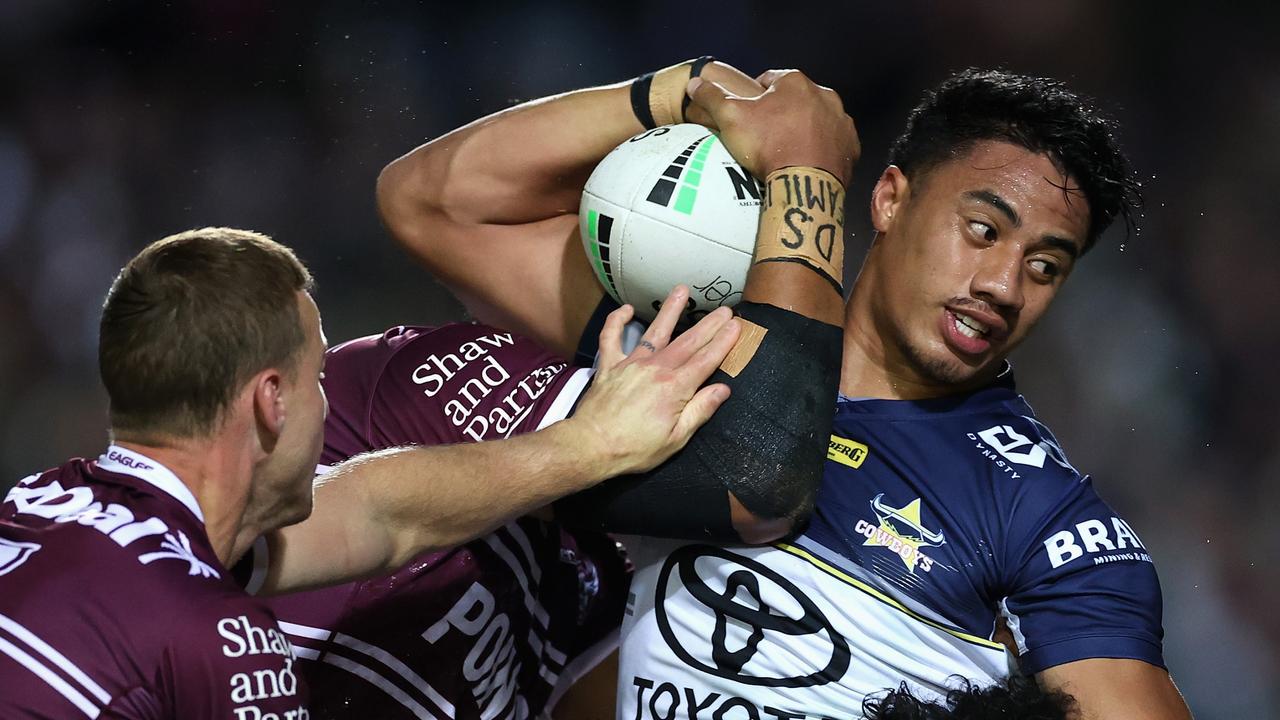 SYDNEY, AUSTRALIA – JUNE 17: Murray Taulagi of the Cowboys is tackled during the round 15 NRL match between the Manly Sea Eagles and the North Queensland Cowboys at 4 Pines Park, on June 17, 2022, in Sydney, Australia. (Photo by Cameron Spencer/Getty Images)