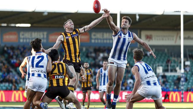 LAUNCESTON, AUSTRALIA - MAY 15: Ben McEvoy of the Hawks and Tom Campbell of the Kangaroos compete for the ball during the 2021 AFL Round 09 match between the Hawthorn Hawks and the North Melbourne Kangaroos at UTAS Stadium on May 15, 2021 in Launceston, Australia. (Photo by Dylan Burns/AFL Photos via Getty Images)