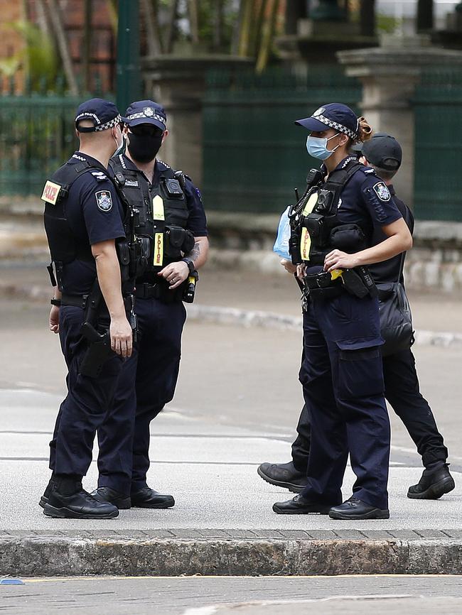 Police officers outside the protest in Brisbane CBD. Picture: NCA NewsWire / Josh Woning