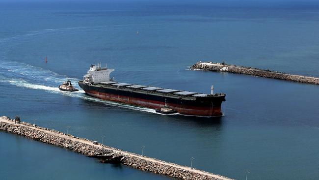 A coal ship enters Newcastle Harbour, which is currently running at 93 per cent capacity. Picture: Peter Lorimer.