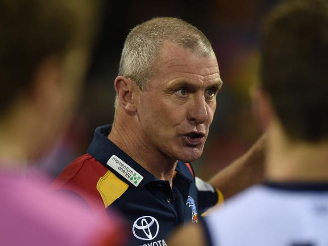 Phil Walsh speaks to his players during his last game — the Round 13 match between Brisbane and Adelaide at the Gabba on June 27.