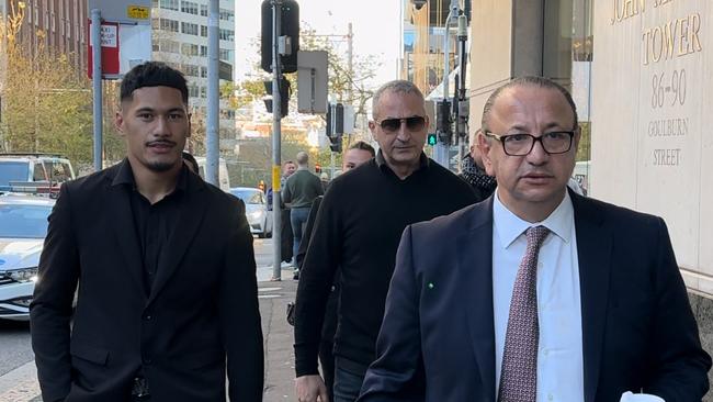 Junior Amone, left, arriving at NSW District Court on Wednesday with lawyer Elias Tabchouri.