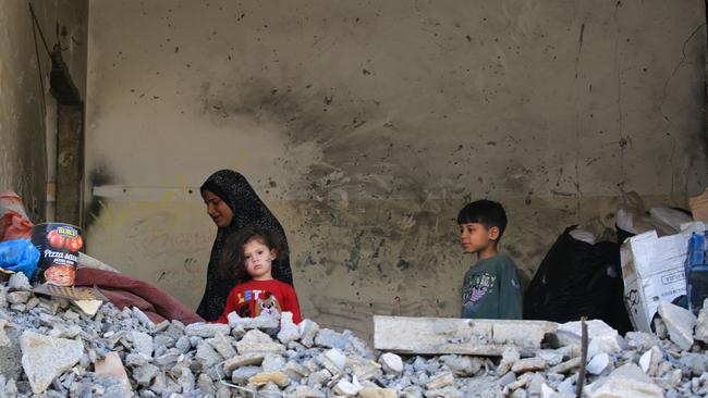 Palestinian children near a damaged building in Rafah. Picture: AFP