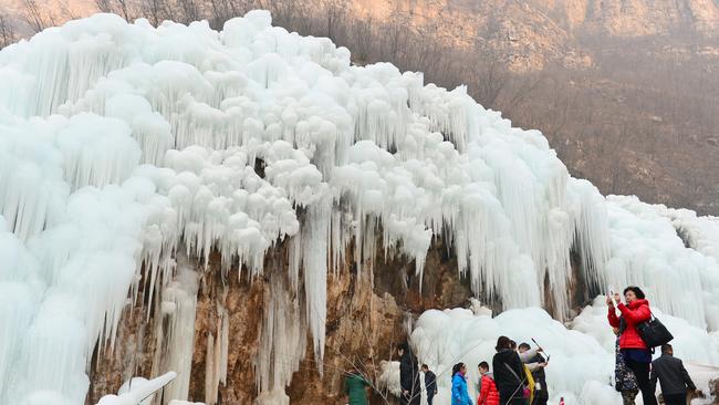 Icicles hang from the rocky mountain where water normally runs freely. Tourists flocked to the frozen waterfall in Taihang Mountain at Shunping County, north China's Hebei Province, on January 3. Picture: Xinhua/Zuma/Australscope