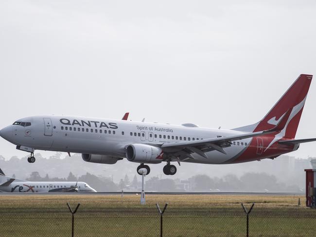 SYDNEY, AUSTRALIA - NewsWire Photos May 6, 2021: A Qantas aircraft landing at Sydney Airport.Picture: NCA NewsWire / James Gourley