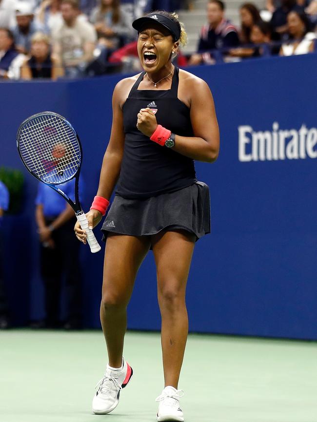 Naomi Osaka of Japan celebrates winning a point in the women's singles finals match against Serena Williams.