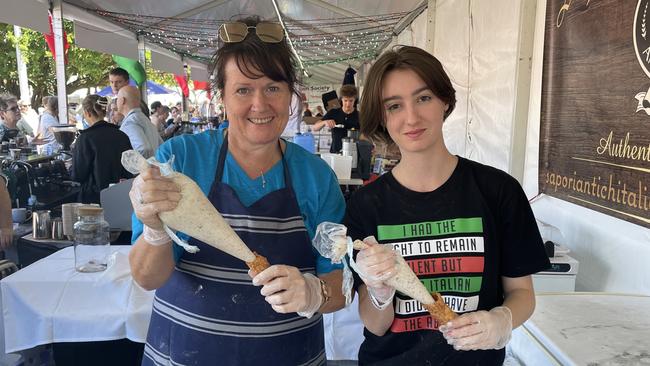 Diana Ealden and Grace Meyers preparing cannoli's for Sapori Antichi Italiani at the La Festa - Food and Wine day as part of Cairns Italian Festival at Fogarty Park. Picture: Andreas Nicola