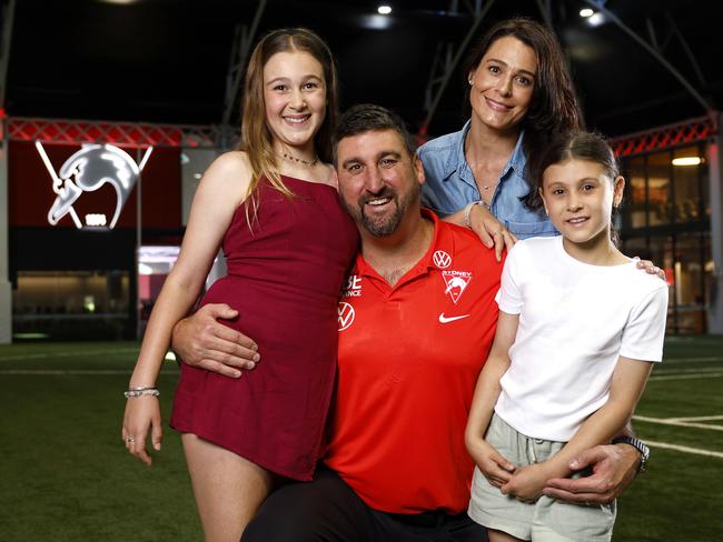 Cox with his wife Kerry and daughters Charlotte and Isabella after being confirmed as the Swans’ new head coach. Picture: Phil Hillyard