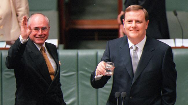 Costello with John Howard after delivering the Federal Budget in Parliament in 2000.