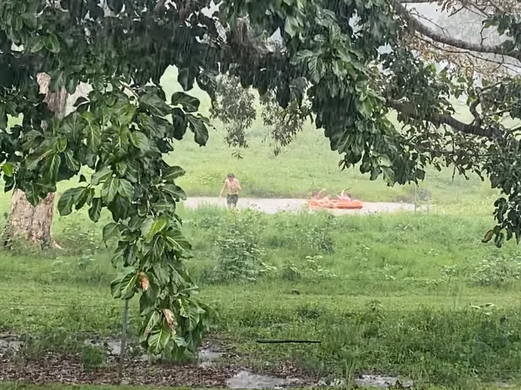 Facebook user Madalyn Barrett shared this photo of children finding joy in the flooding at Mount Jukes in the Mackay region, January 12, 2023.