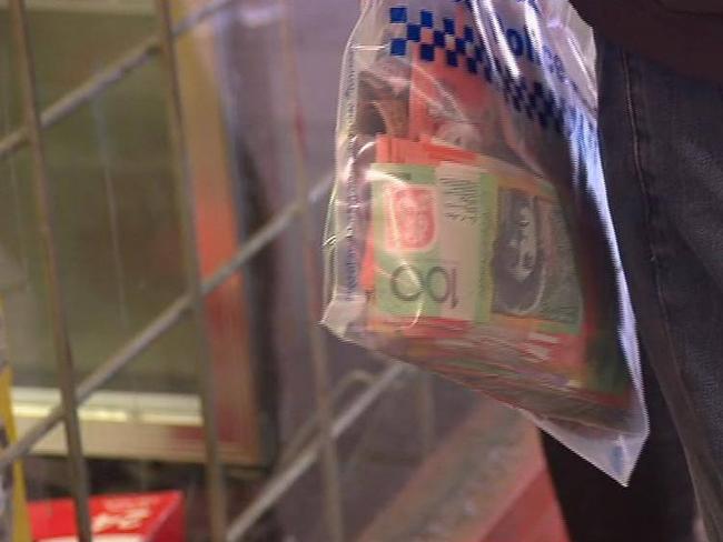 Cash seized in a raid on a tobacco shop in Fairfield this morning. Source: 7 News