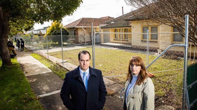 Vincent Tarzia and Michelle Lensink outside the fenced-off homes on York Ave at Clovelly Park. Picture: Tom Huntley