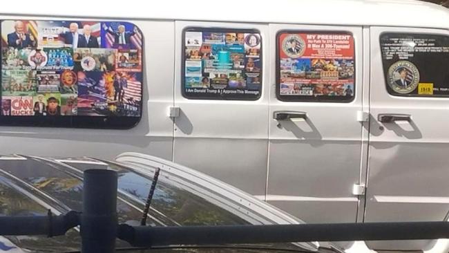 A van with windows covered with an assortment of stickers, said to be the one seized. Picture: AP