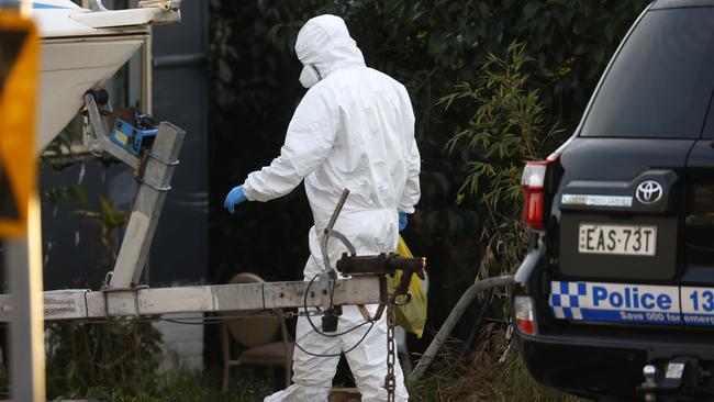 Forensic investigator at the Pendle Hill home where a woman in her 80s died from Covid-19. Picture: Jonathan Ng