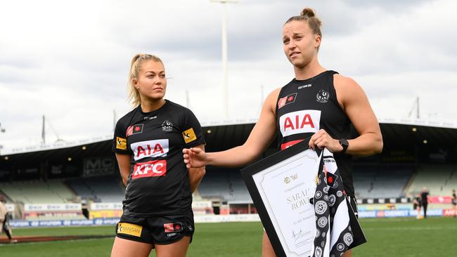 Sarah Rowe is presented a plaque for reaching 50 games before the clash. (Photo by Quinn Rooney/Getty Images)