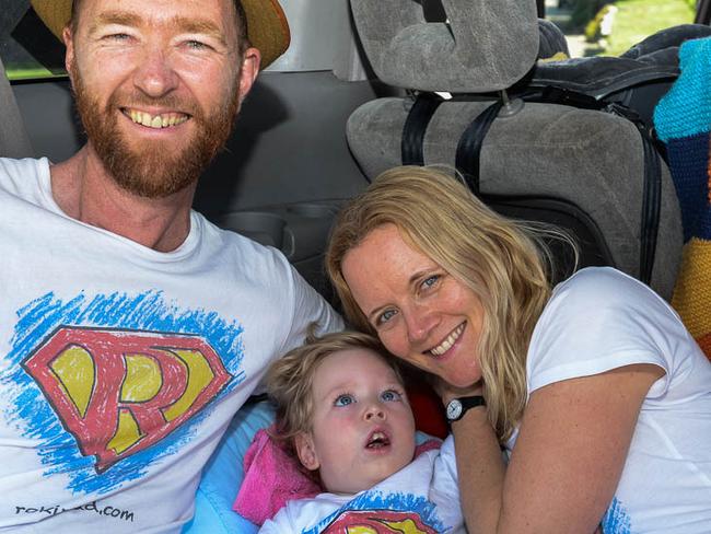 Roki with mum and dad when he was younger, at one of their fundraising events. Picture: Michael Mannington.